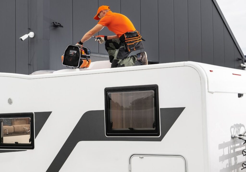 RV technician checking the rv roof