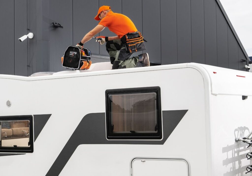 RV technician doing an rv roof repair