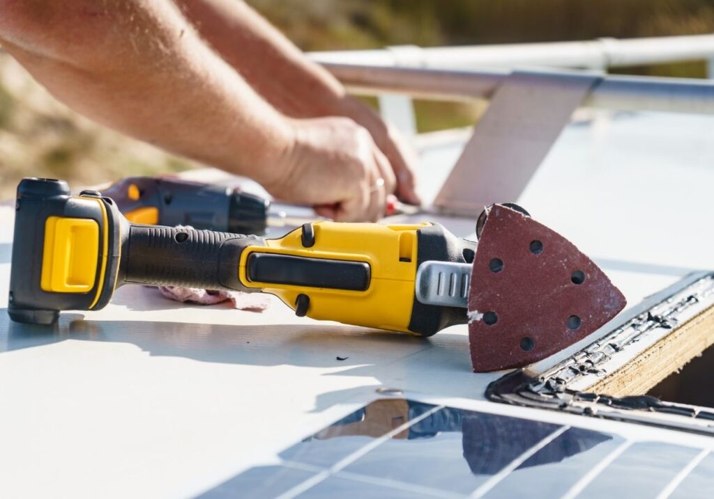 RV technician doing an rv roof repair
