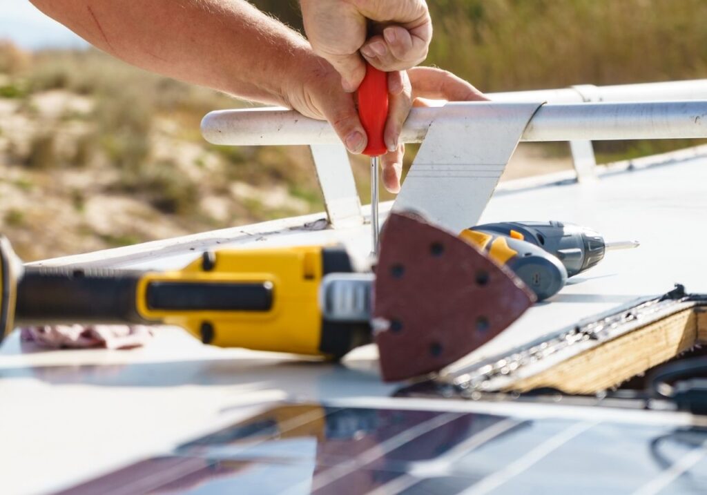 RV technician doing an rv roof repair