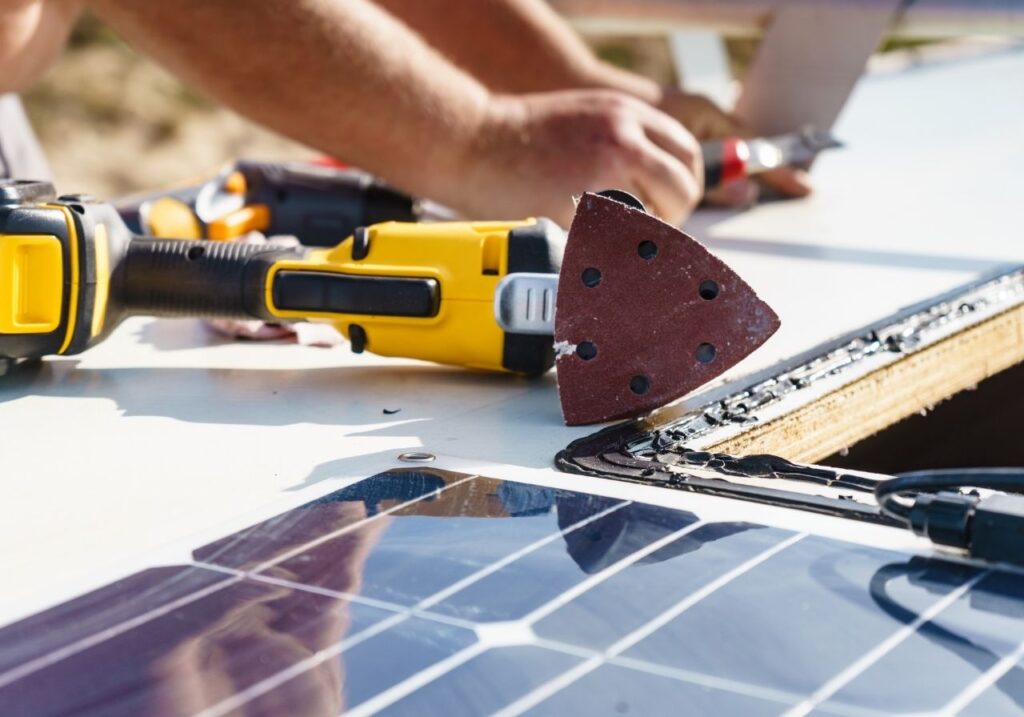 RV technician doing an rv roof repair