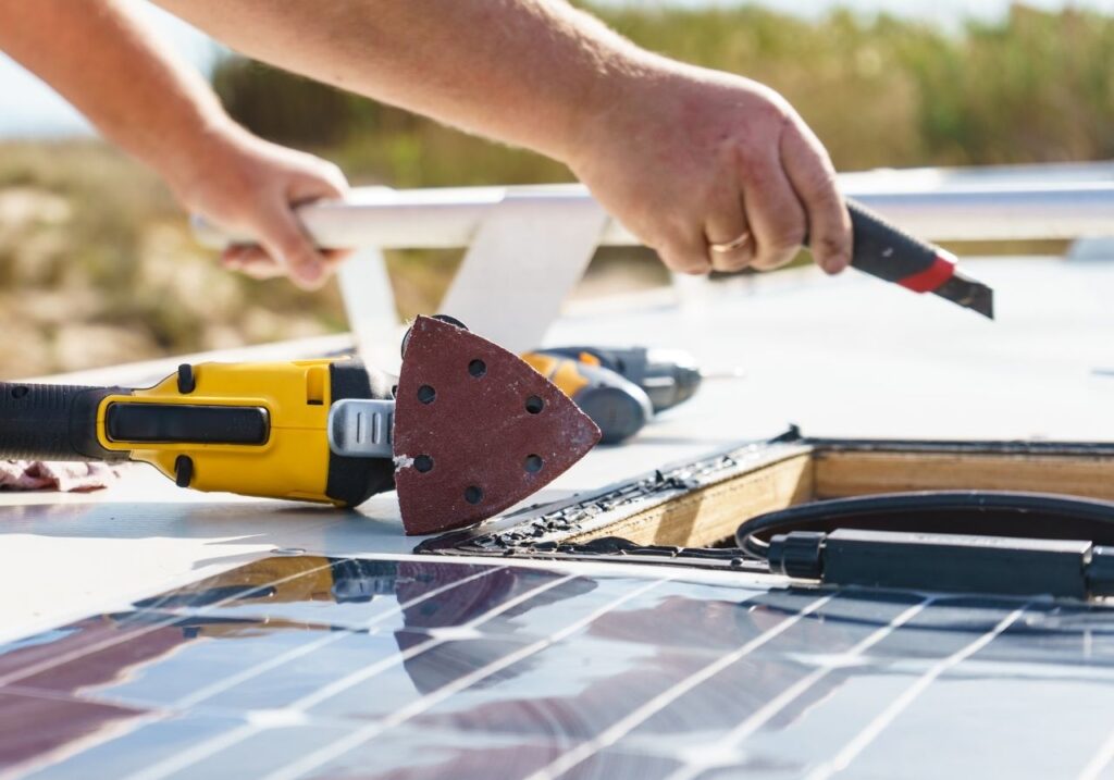 RV technician doing an rv roof repair