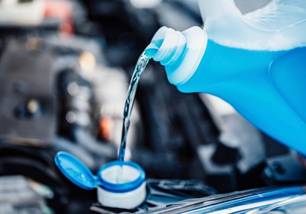 image of pouring a winterization fluid