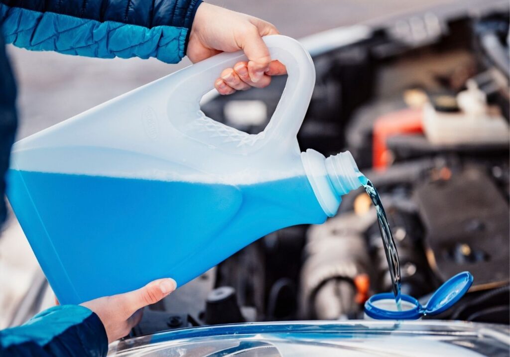 image of pouring a winterization fluid