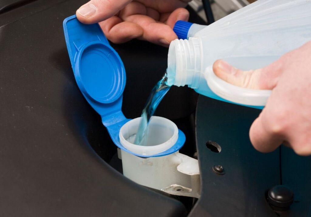 image of pouring a winterization fluid