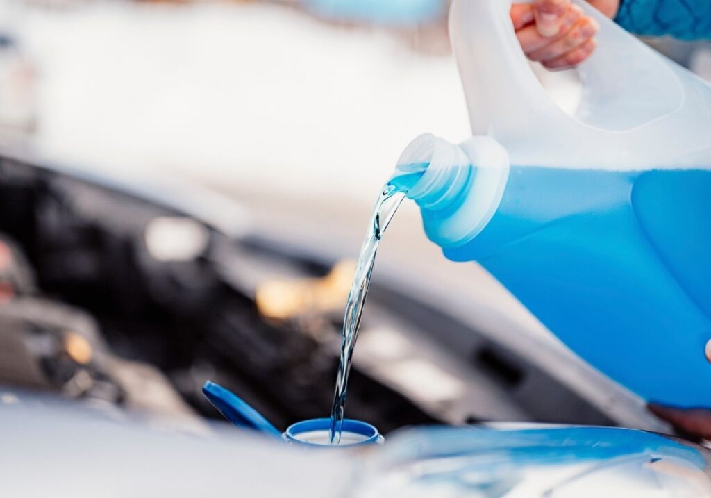 image of pouring a winterization fluid
