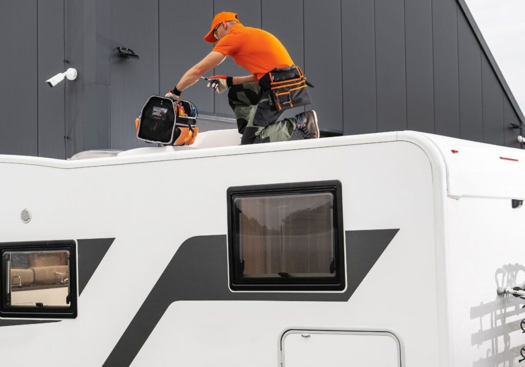 RV technician fixing an rv AC