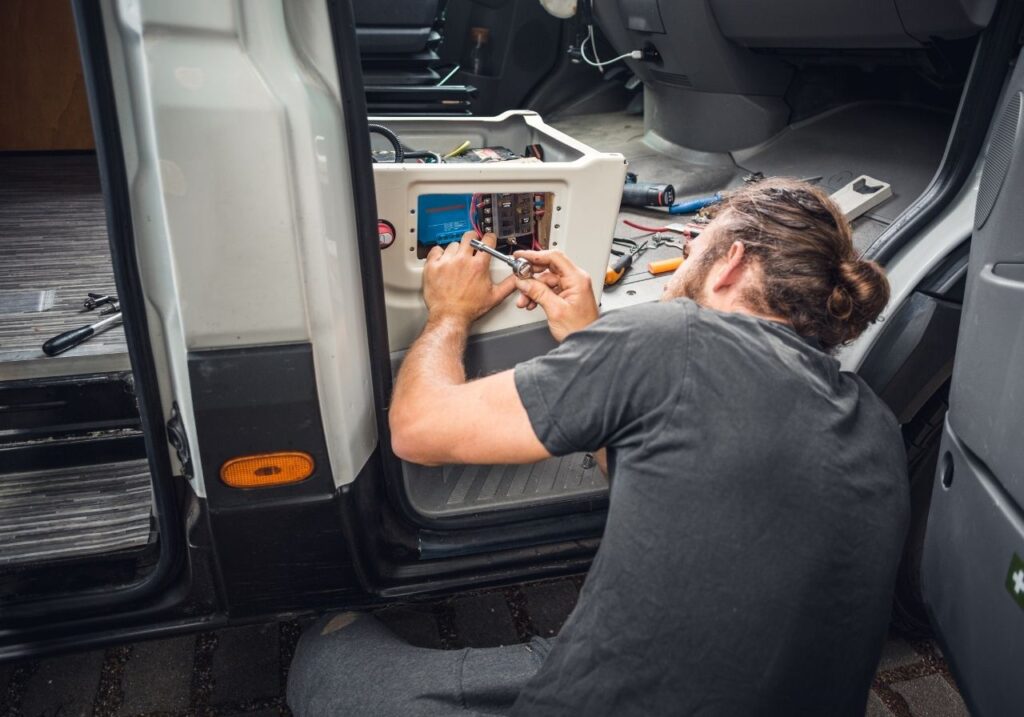 RV electrician fixing a broken ac