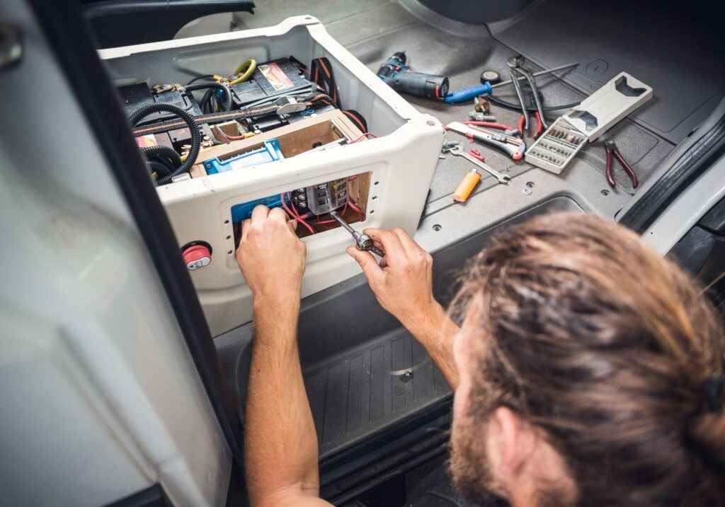 RV electrician fixing a broken ac