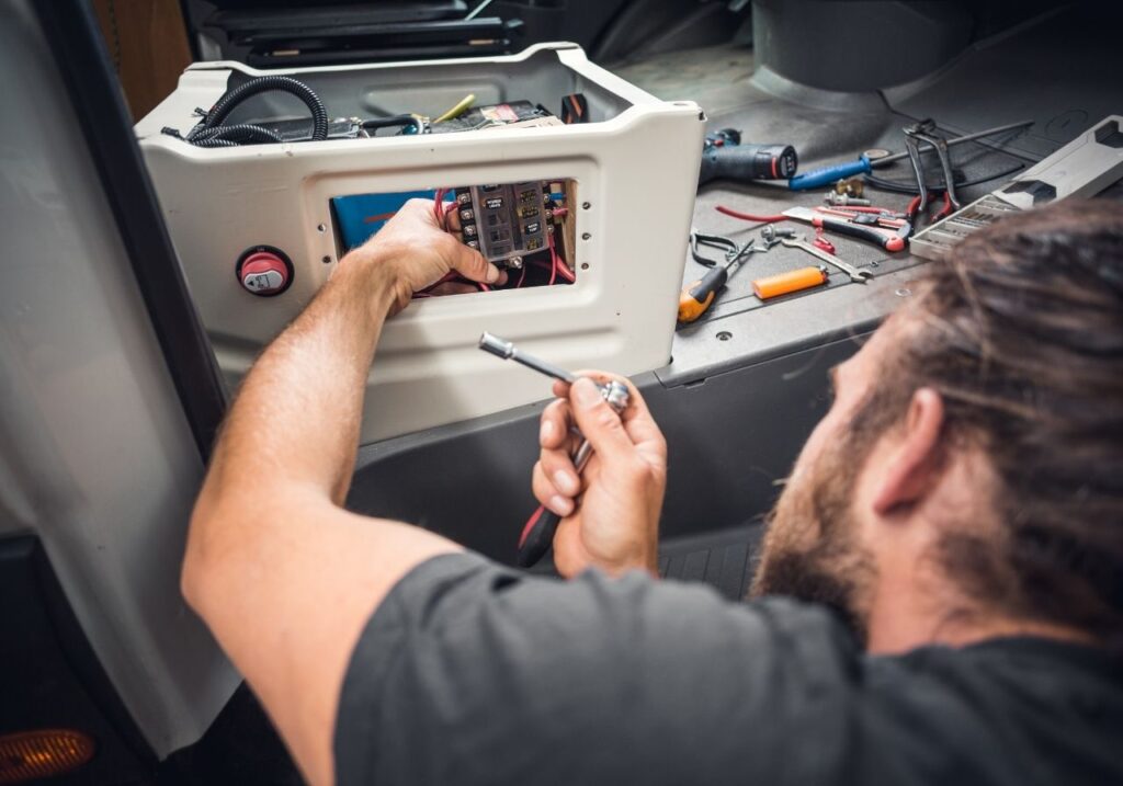 RV electrician fixing a broken ac
