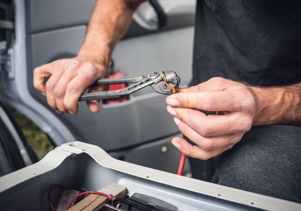 RV electrician fixing a broken ac