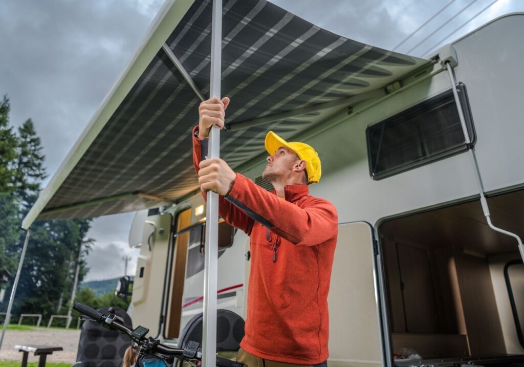 RV technician checking the rv awning